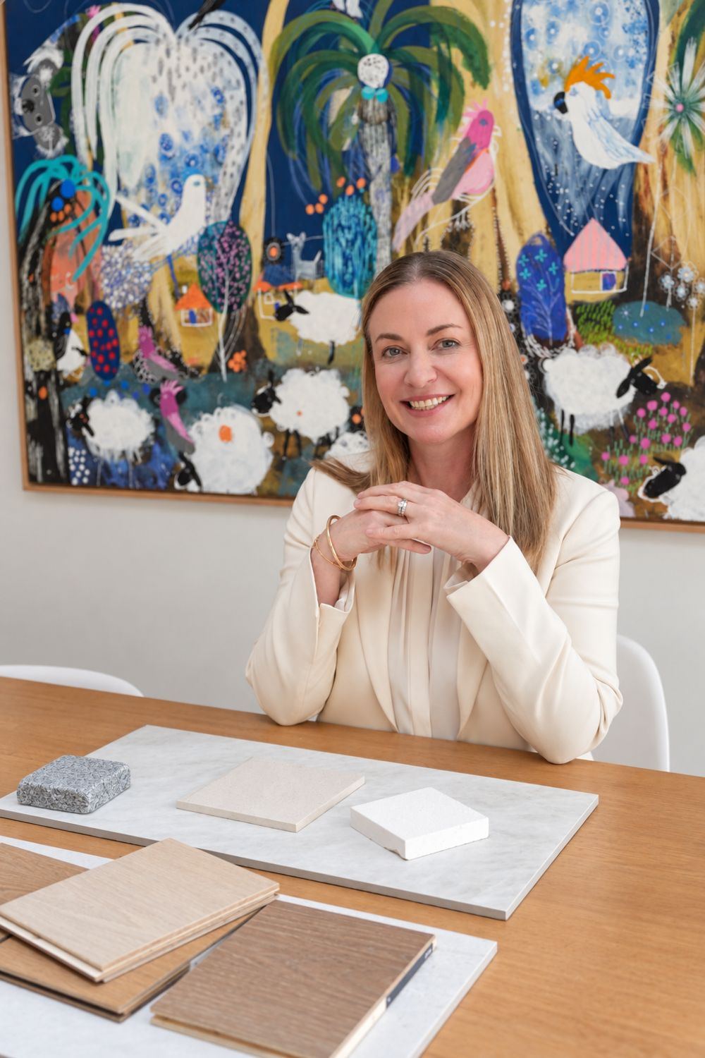 Nicole Darragh at a timber table with stone and oak material samples