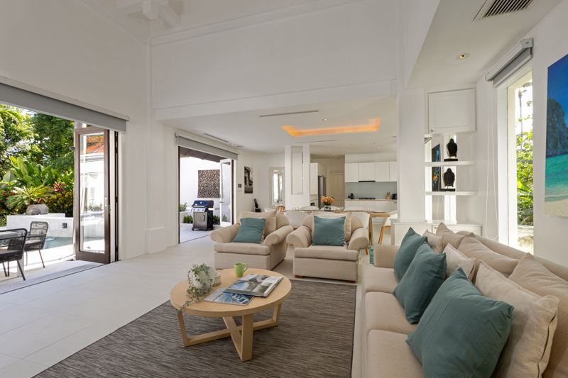 The renovated living room, now light and open to the garden and pool