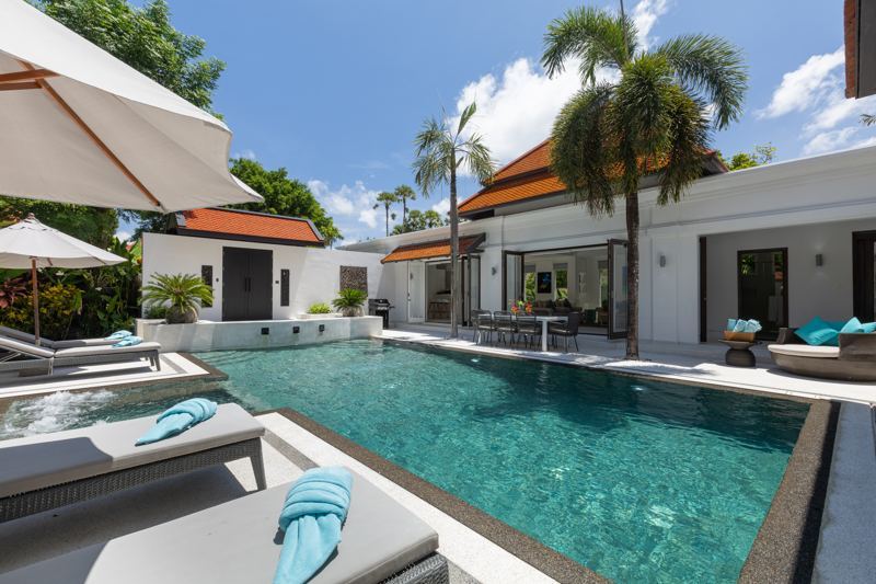 Poolside terrace with outdoor dining and open living room